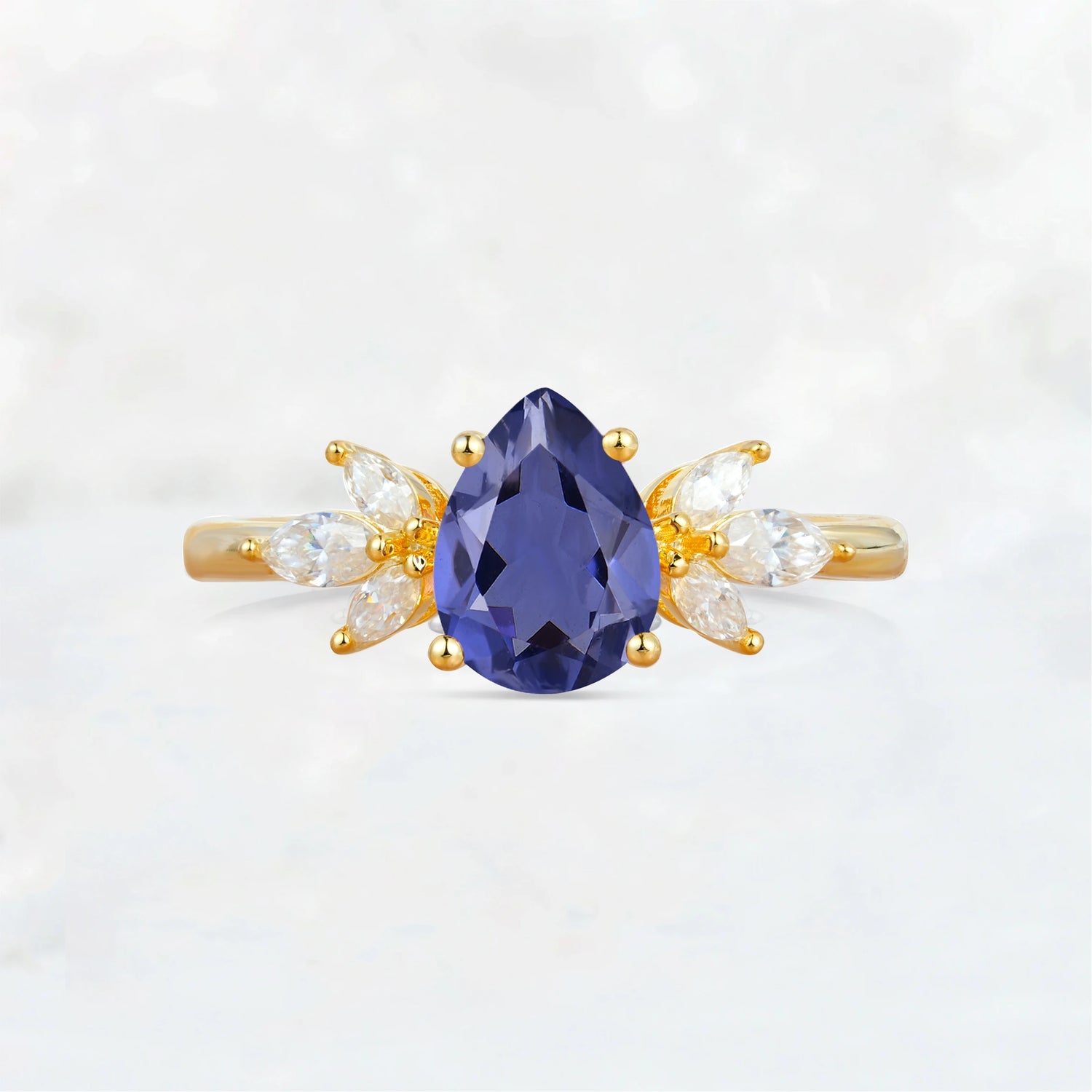 Elegant Pear-Shaped Tanzanite Engagement Ring with Floral Side Stones