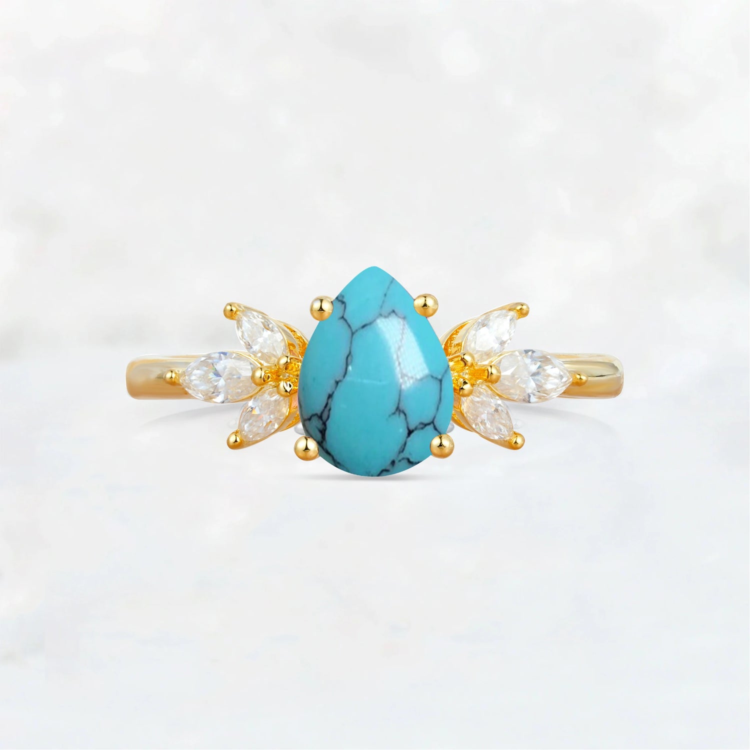Elegant Pear-Shaped Turquoise Engagement Ring with Floral Side Stones