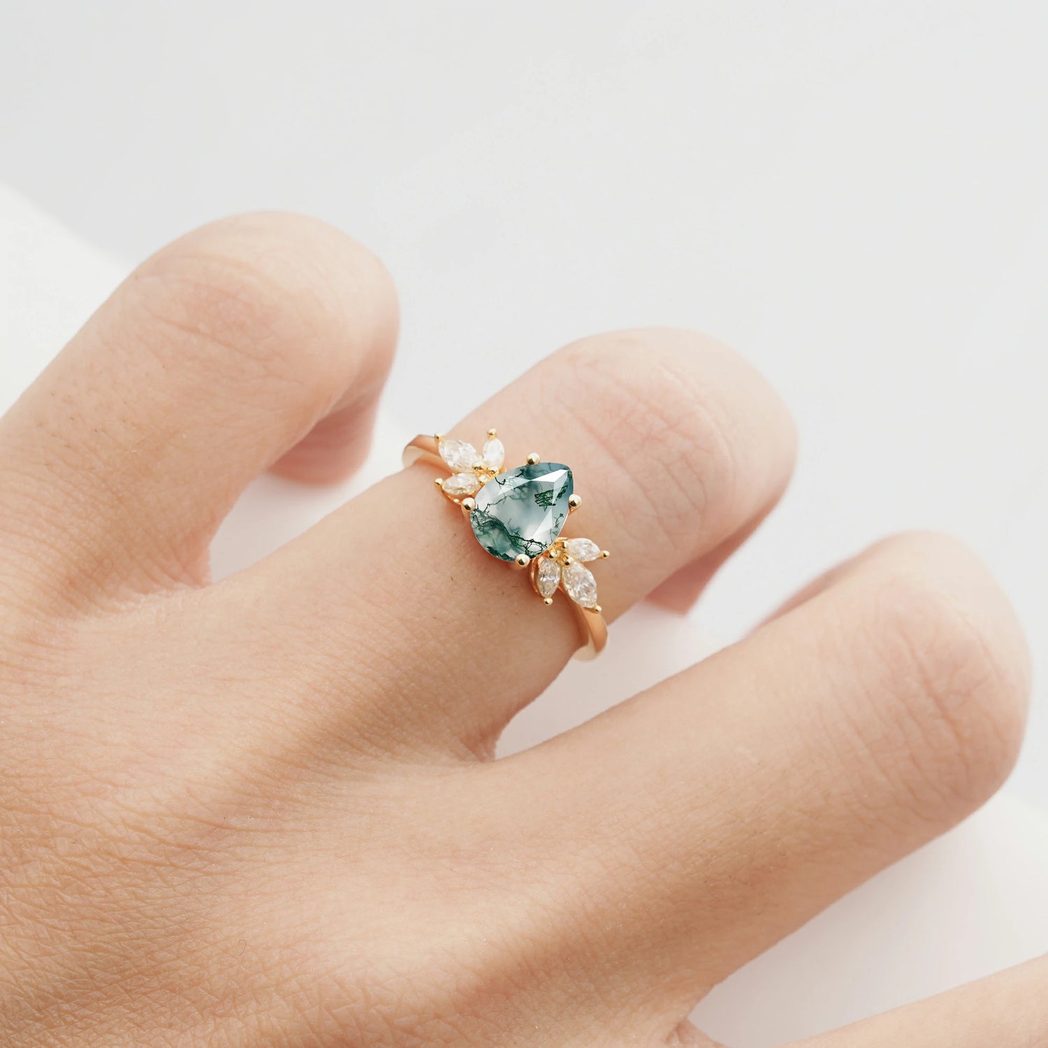 Elegant Pear-Shaped Moss Agate Engagement Ring with Floral Side Stones