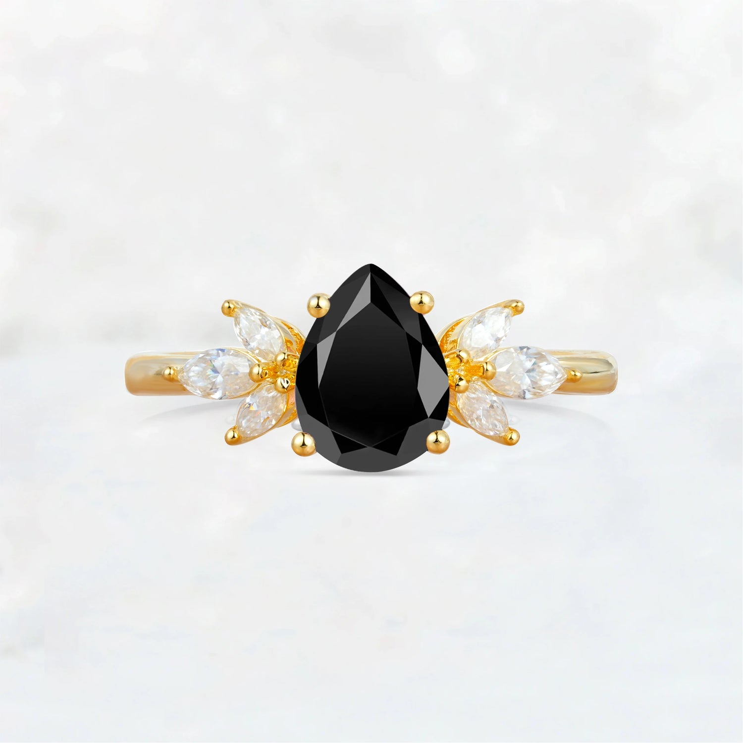 Elegant Pear-Shaped Black Onyx Engagement Ring with Floral Side Stones