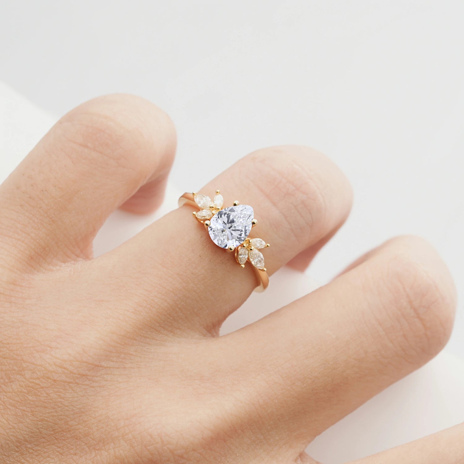 Elegant Pear-Shaped Lab Diamond Engagement Ring with Floral Side Stones