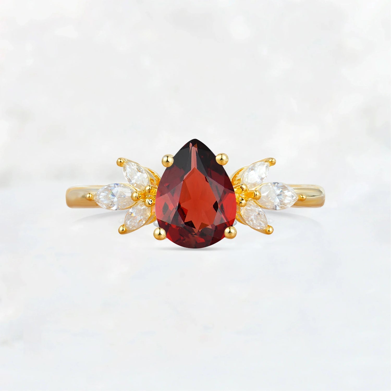 Elegant Pear-Shaped Garnet Engagement Ring with Floral Side Stones