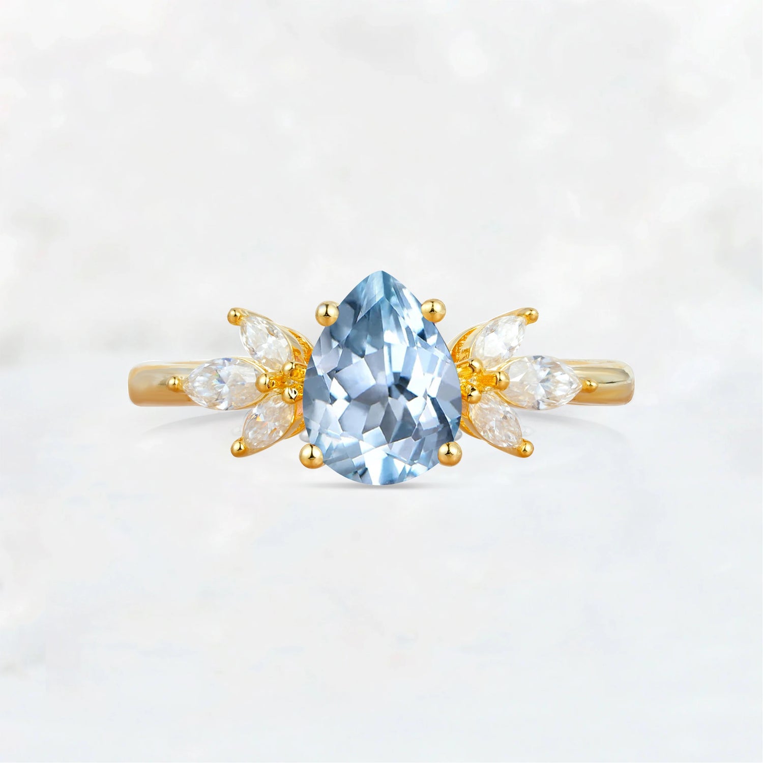 Elegant Pear-Shaped Aquamarine Engagement Ring with Floral Side Stones