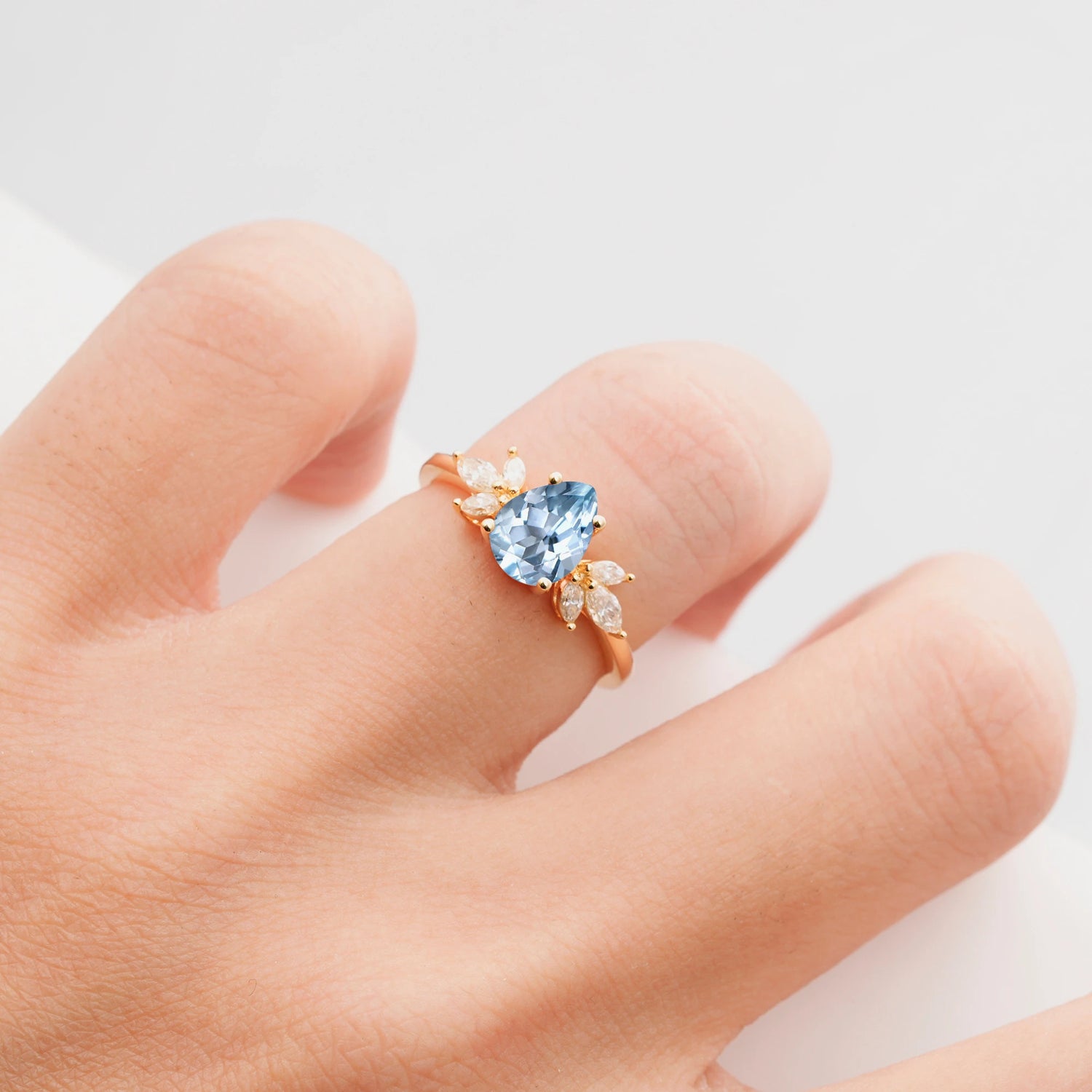 Elegant Pear-Shaped Aquamarine Engagement Ring with Floral Side Stones
