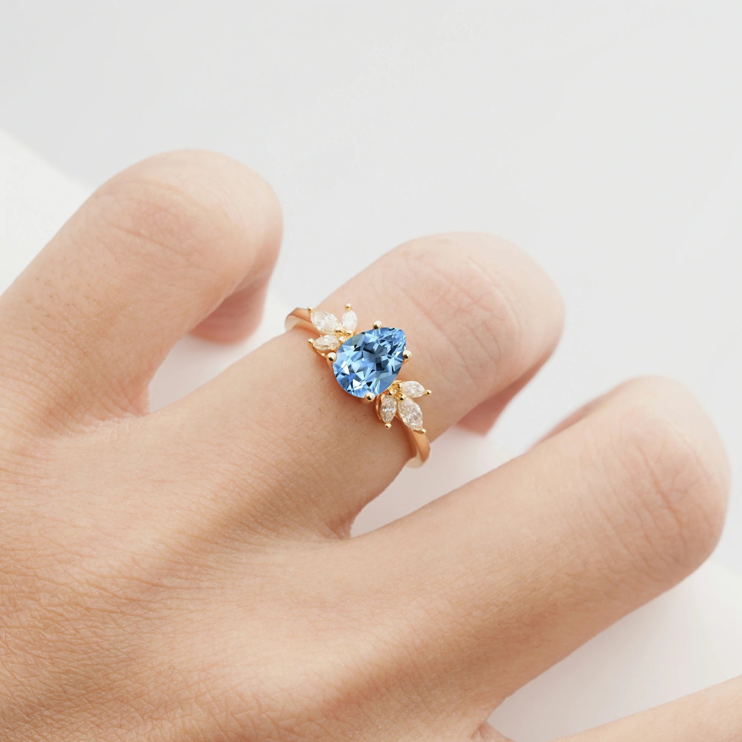 Elegant Pear-Shaped Aquamarine Engagement Ring with Floral Side Stones