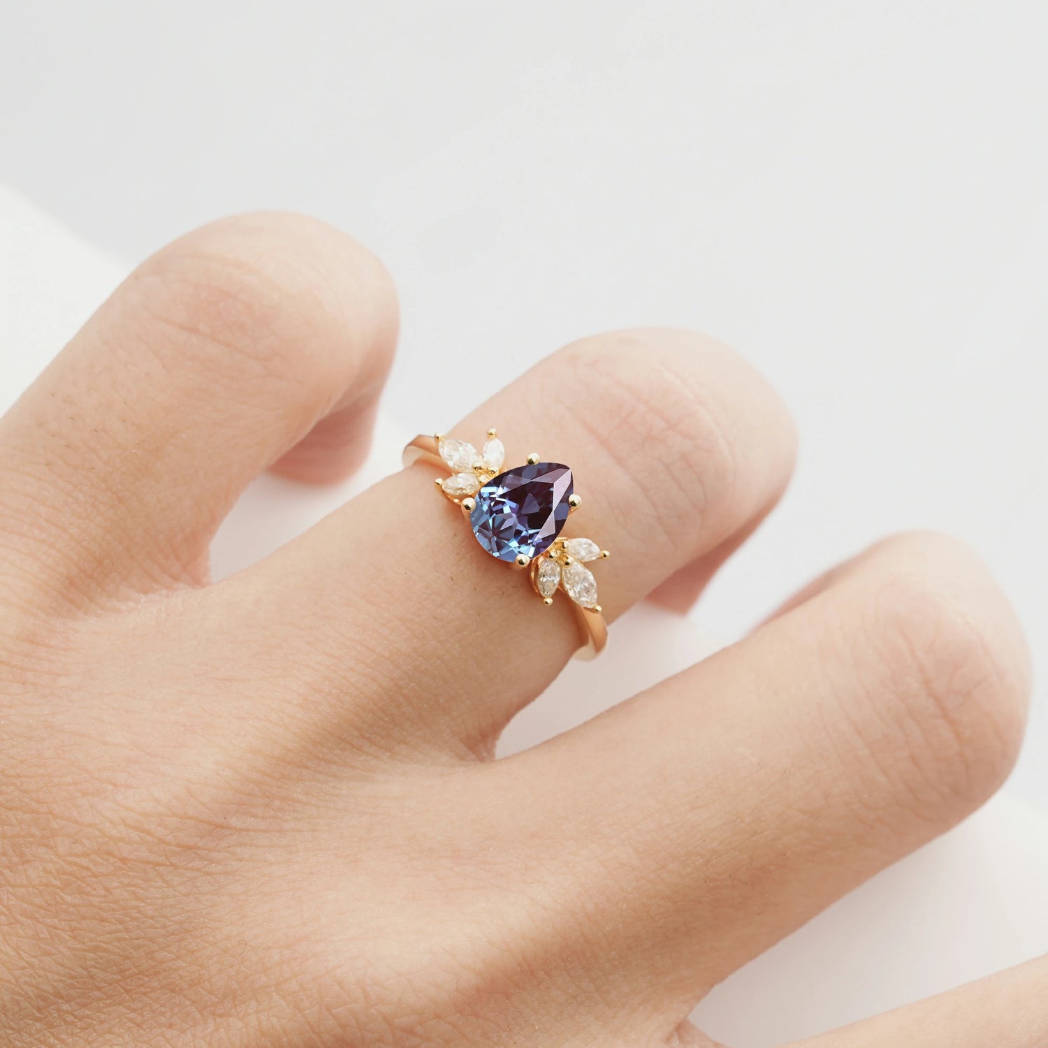Elegant Pear-Shaped Alexandrite Engagement Ring with Floral Side Stones