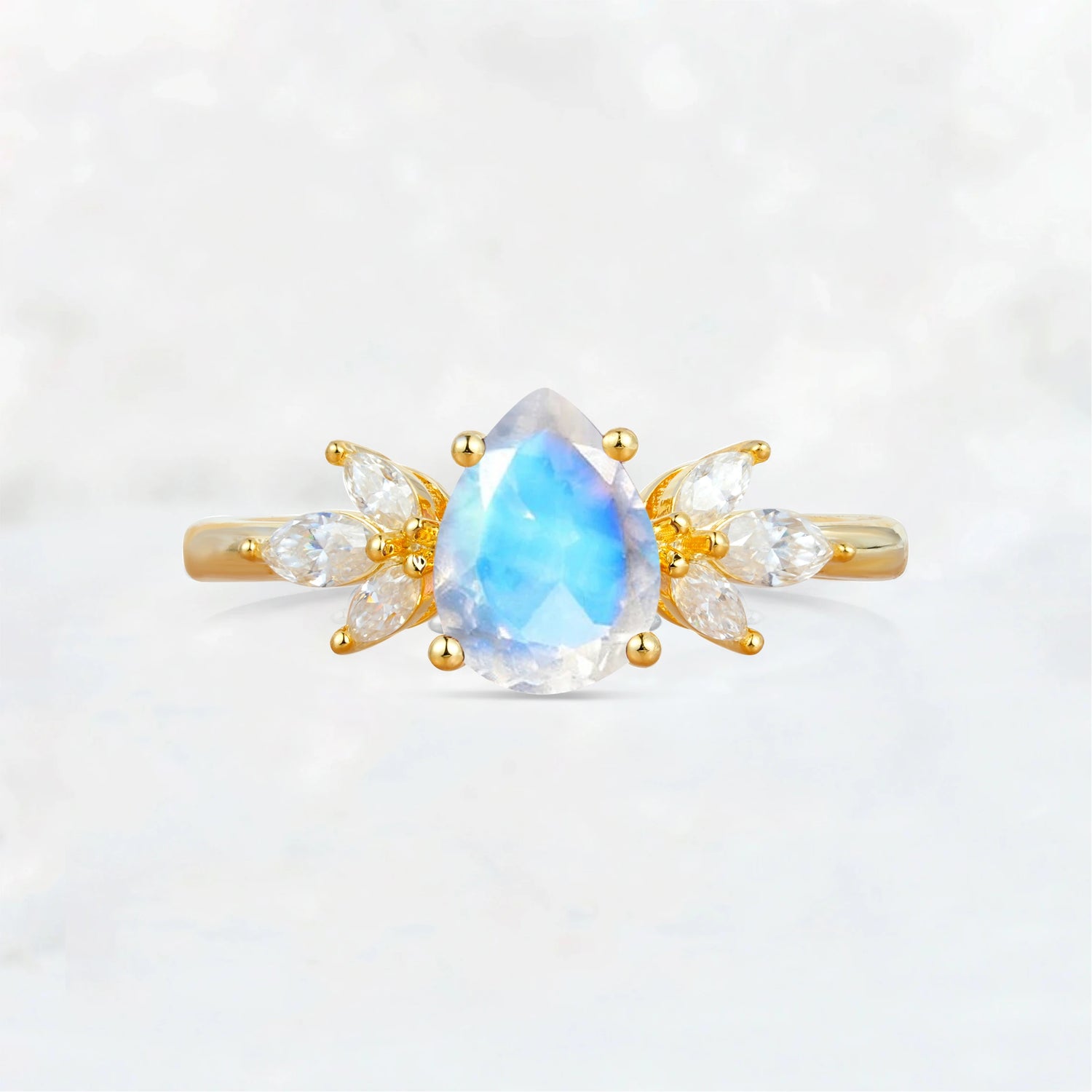 Elegant Pear-Shaped Moonstone Engagement Ring with Floral Side Stones