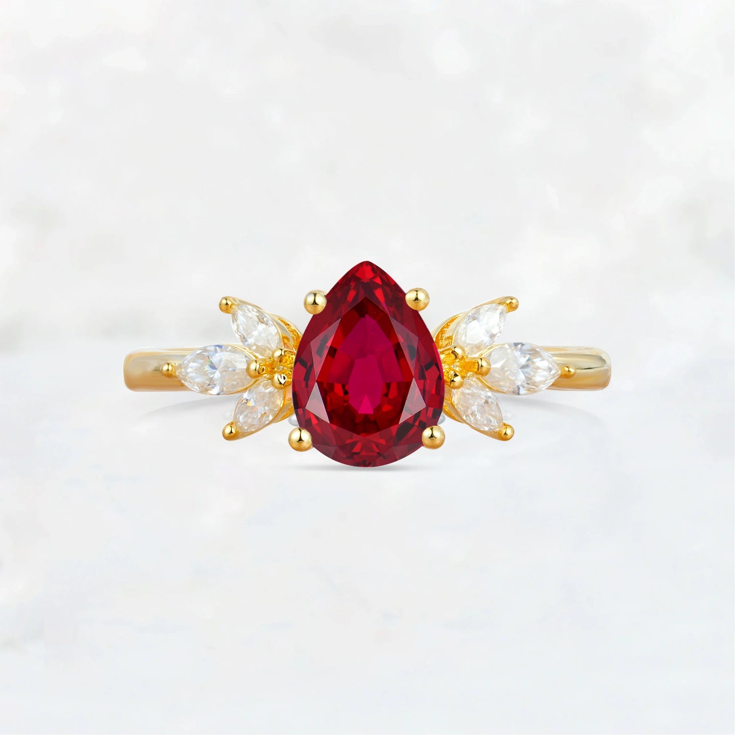 Elegant Pear-Shaped Ruby Engagement Ring with Floral Side Stones