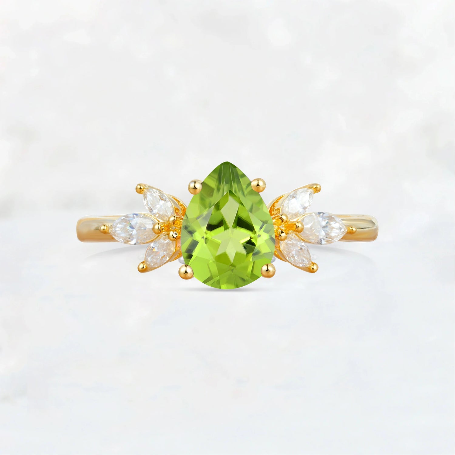 Elegant Pear-Shaped Peridot Engagement Ring with Floral Side Stones