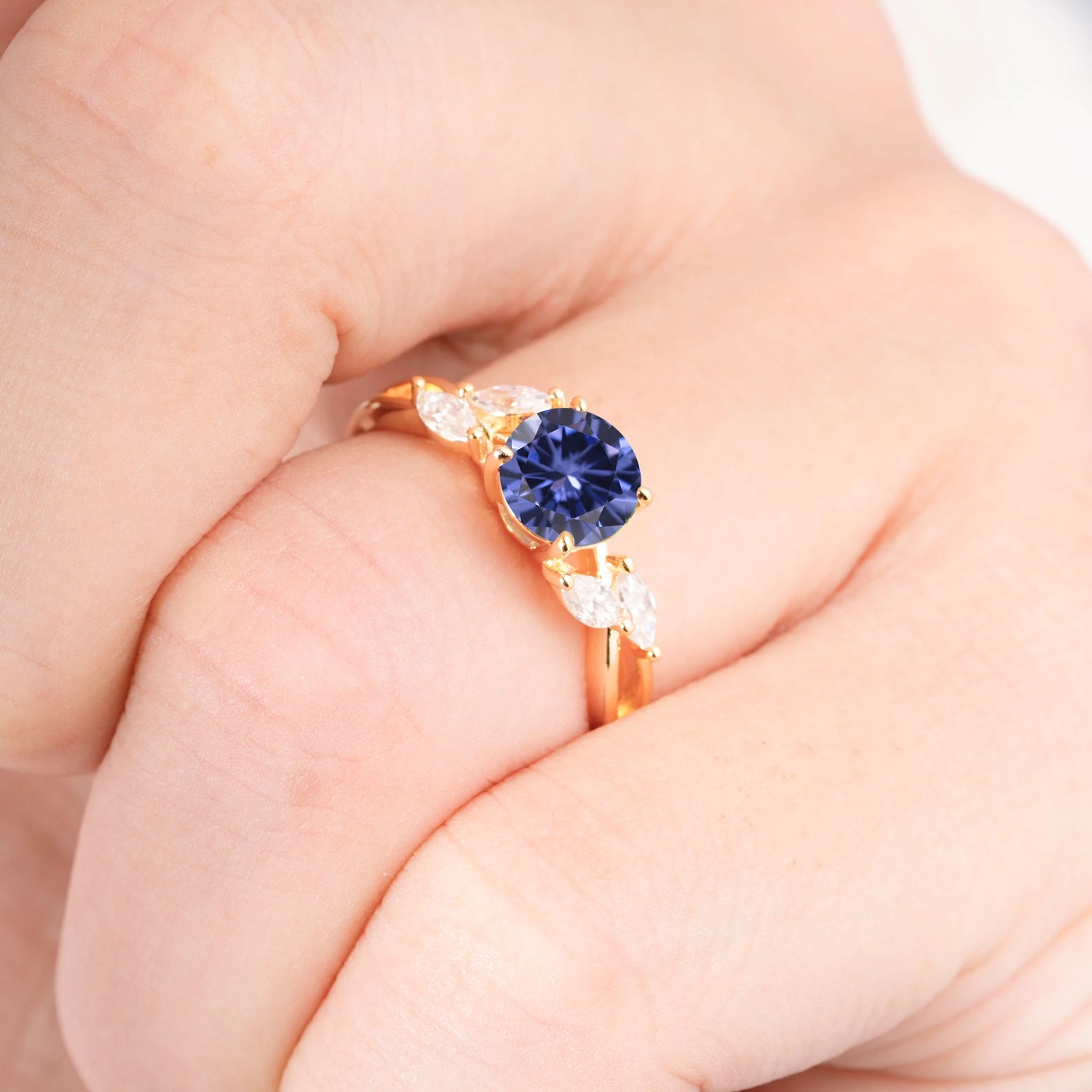 Twisted Band Round Cut Tanzanite Engagement Ring with Marquise Accent