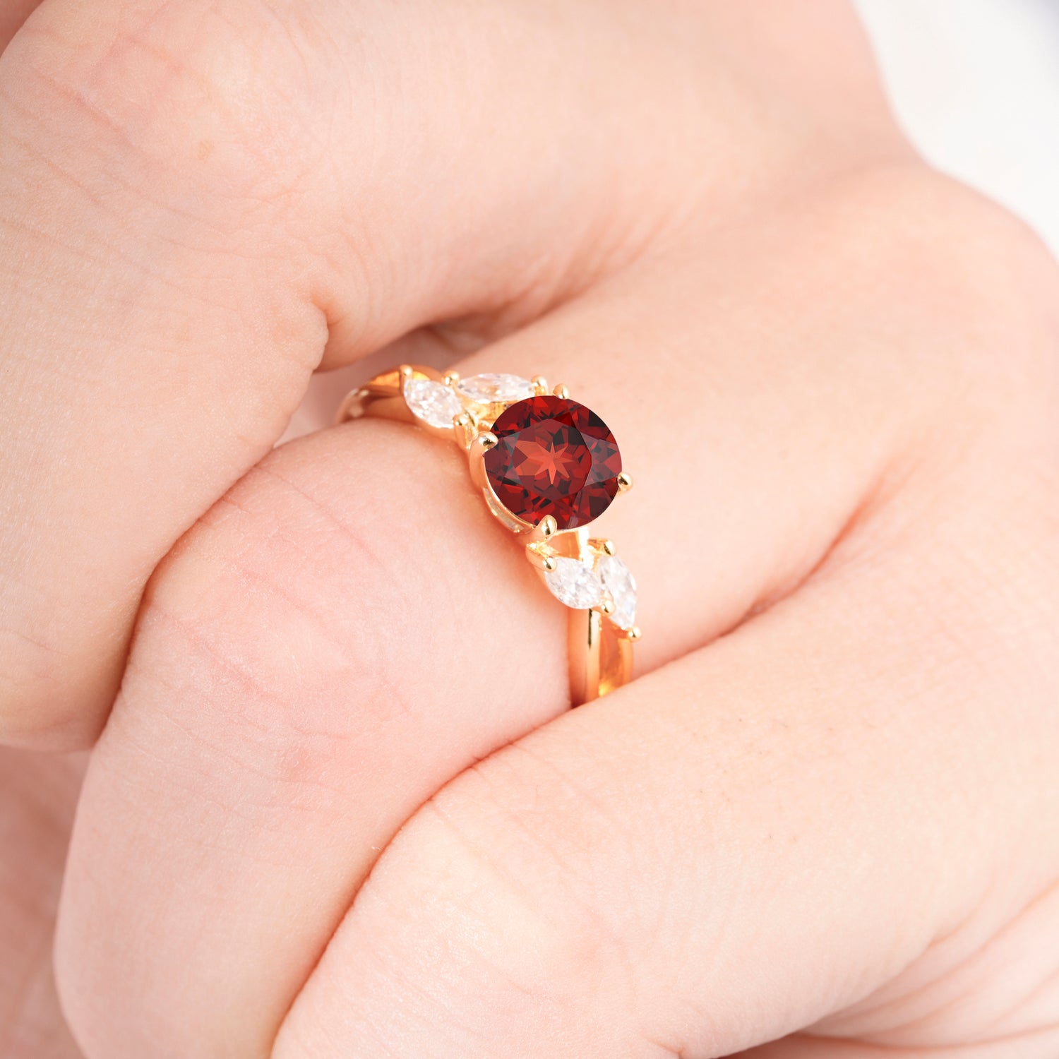 Twisted Band Round Cut Garnet Engagement Ring with Marquise Accent