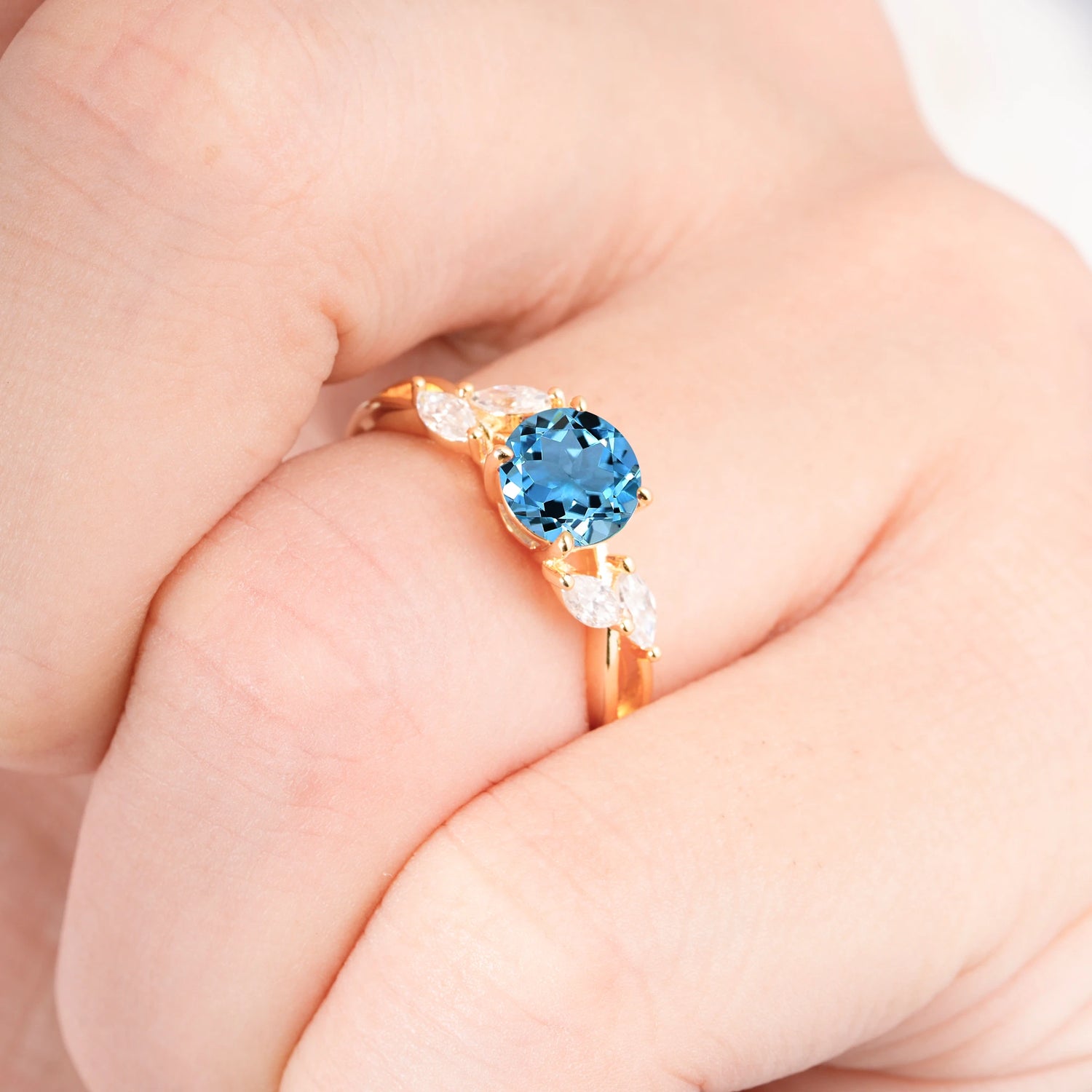 Twisted Band Round Cut Aquamarine Engagement Ring with Marquise Accent