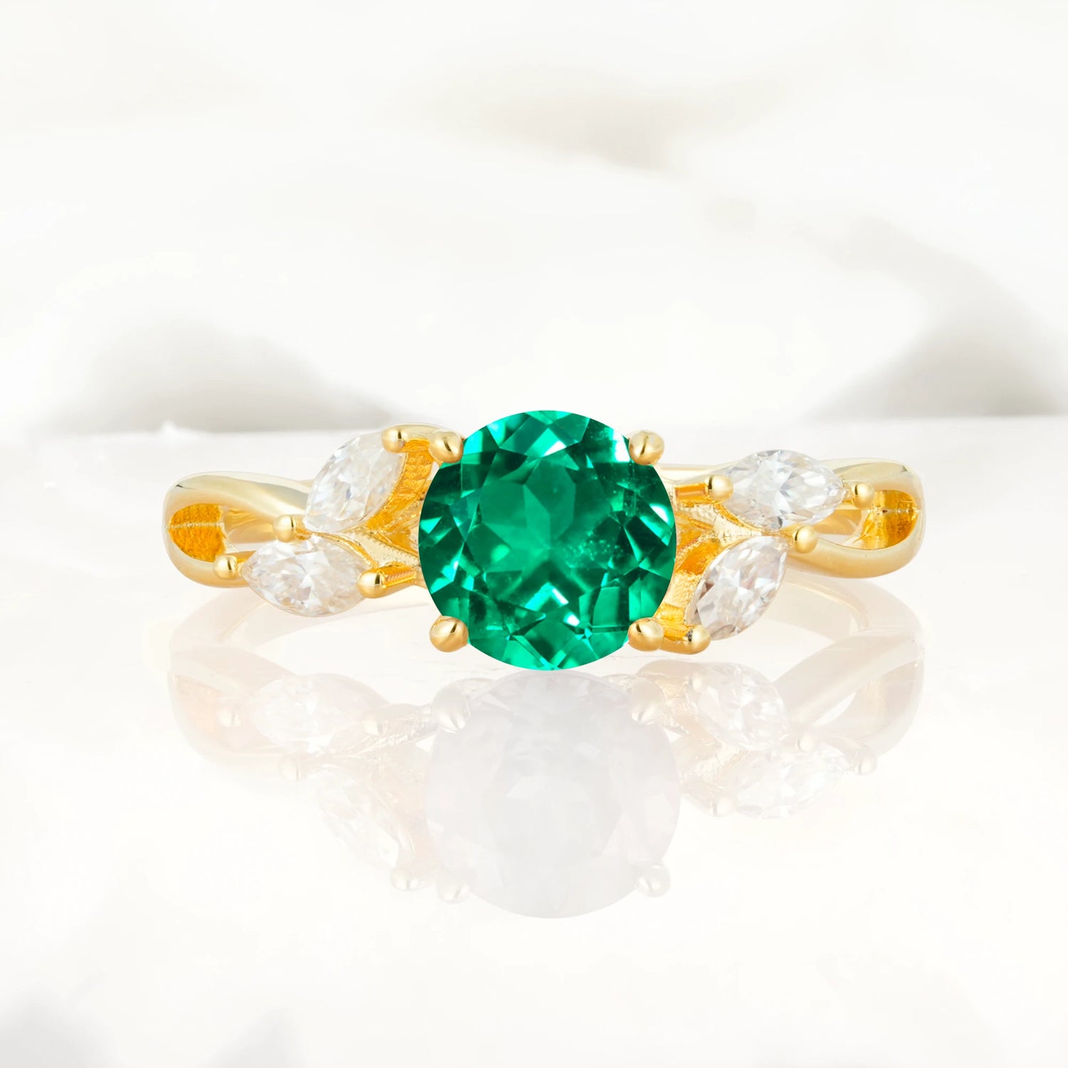 Twisted Band Round Cut Emerald Engagement Ring with Marquise Accent