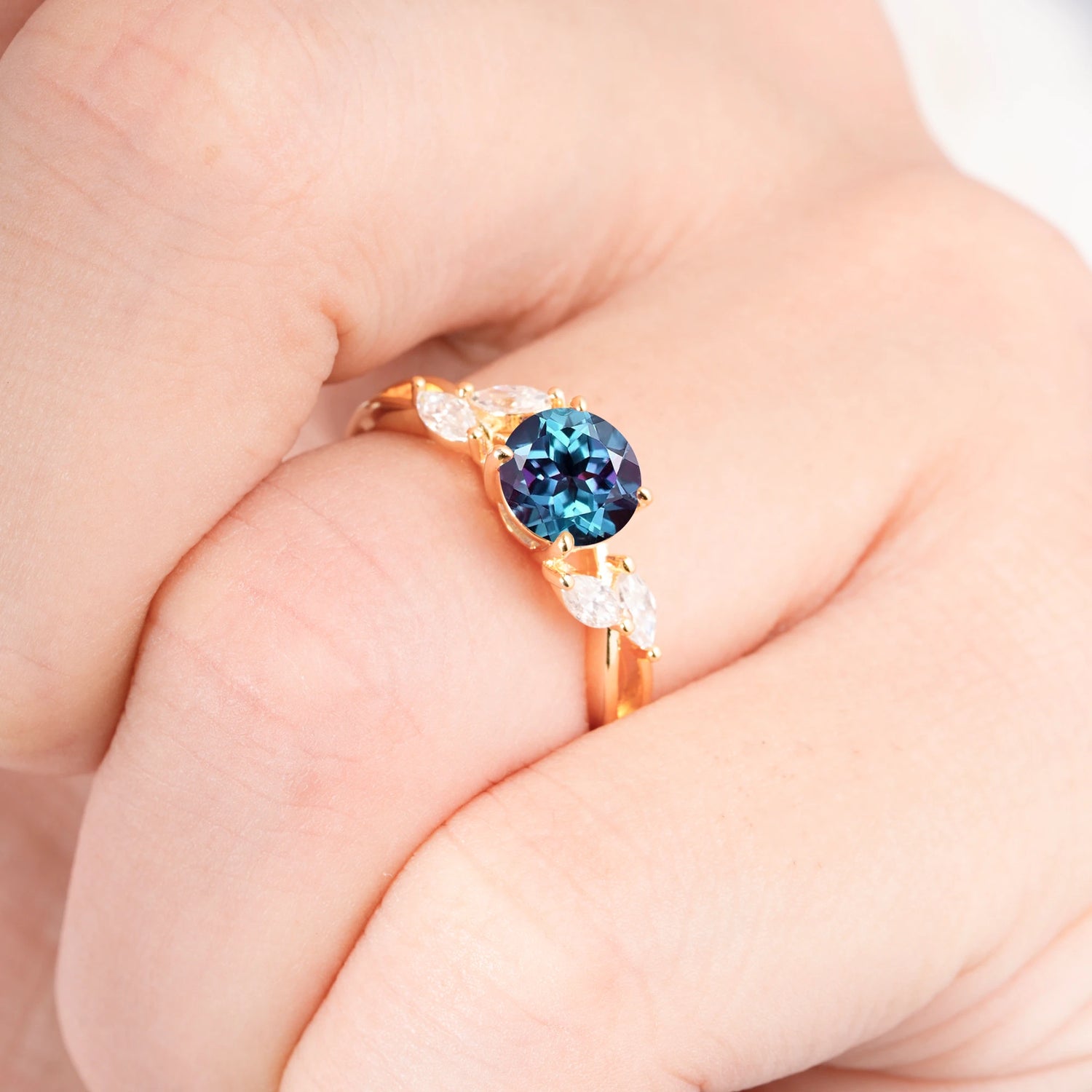 Twisted Band Round Cut Alexandrite Engagement Ring with Marquise Accent
