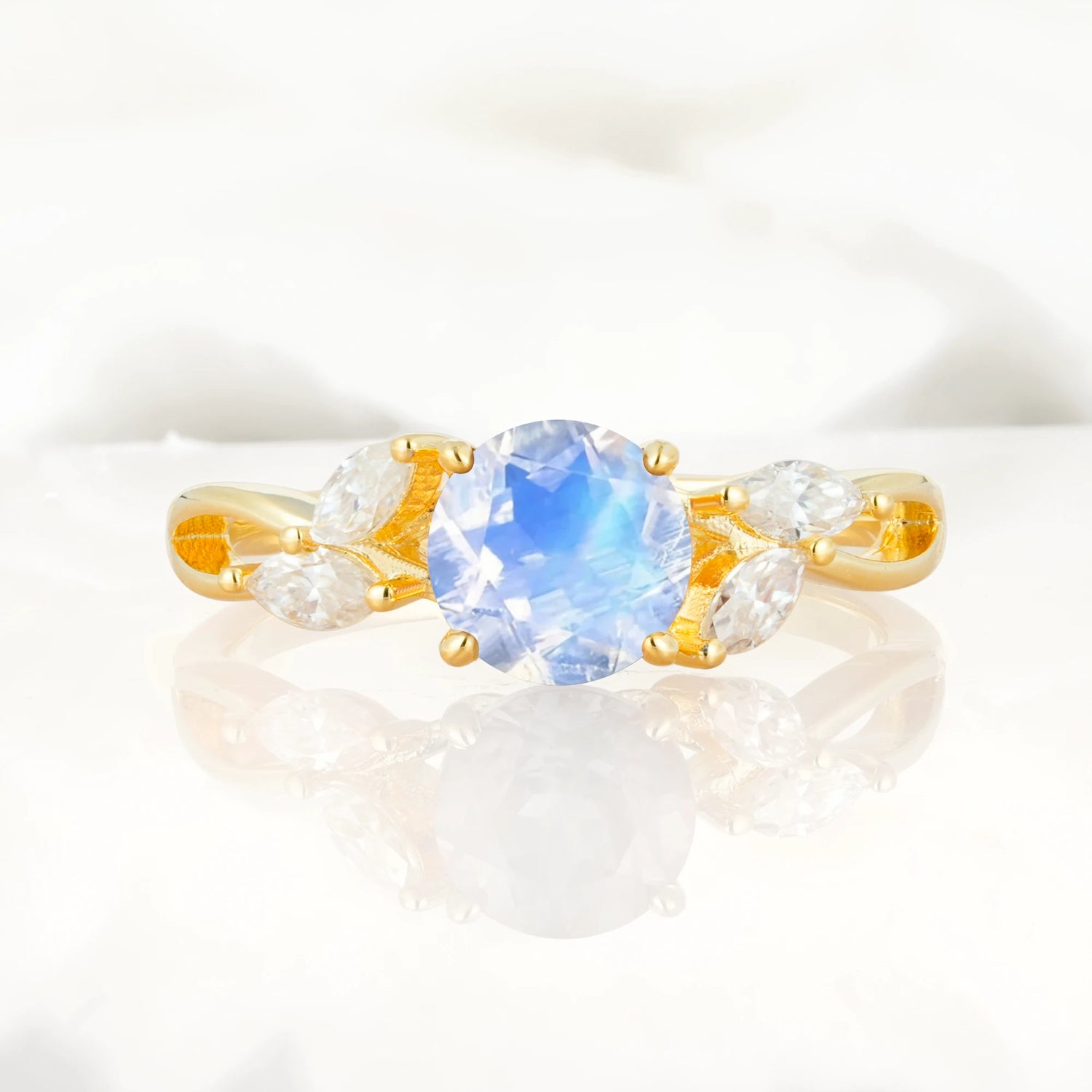 Twisted Band Round Cut Moonstone Engagement Ring with Marquise Accent