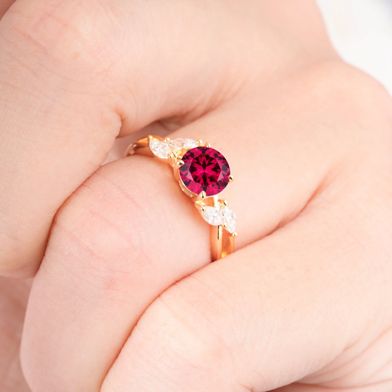 Twisted Band Round Cut Ruby Engagement Ring with Marquise Accent