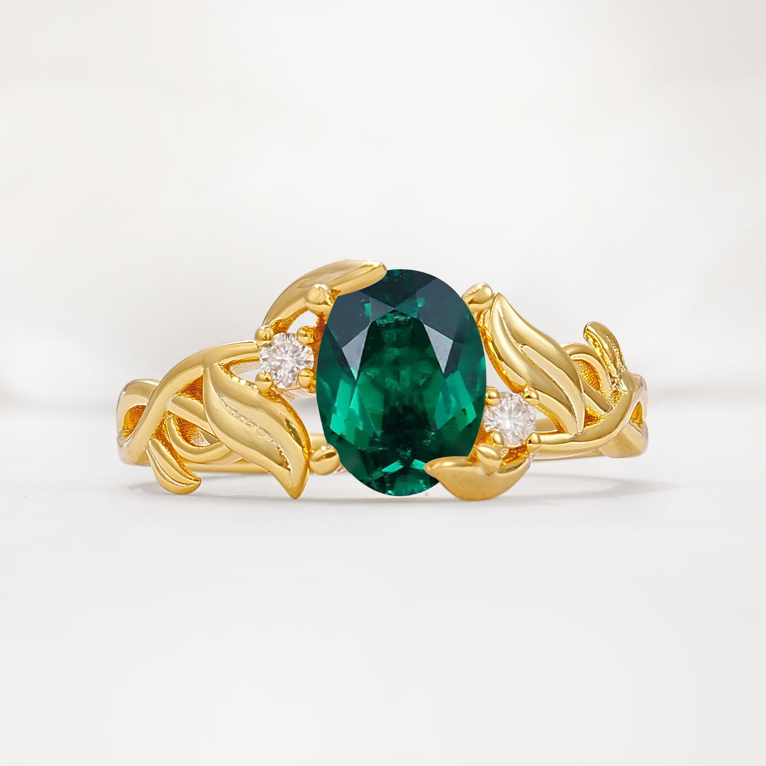 Natural Inspired Oval Cut Leaf Vine Side Stone Emerald Engagement Ring
