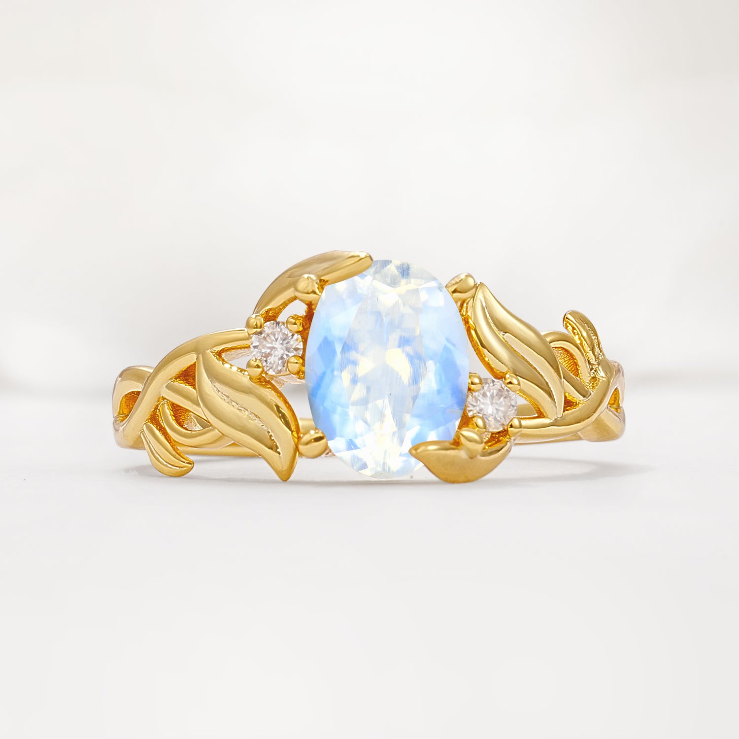 Natural Inspired Oval Cut Leaf Vine Side Stone Moonstone Engagement Ring