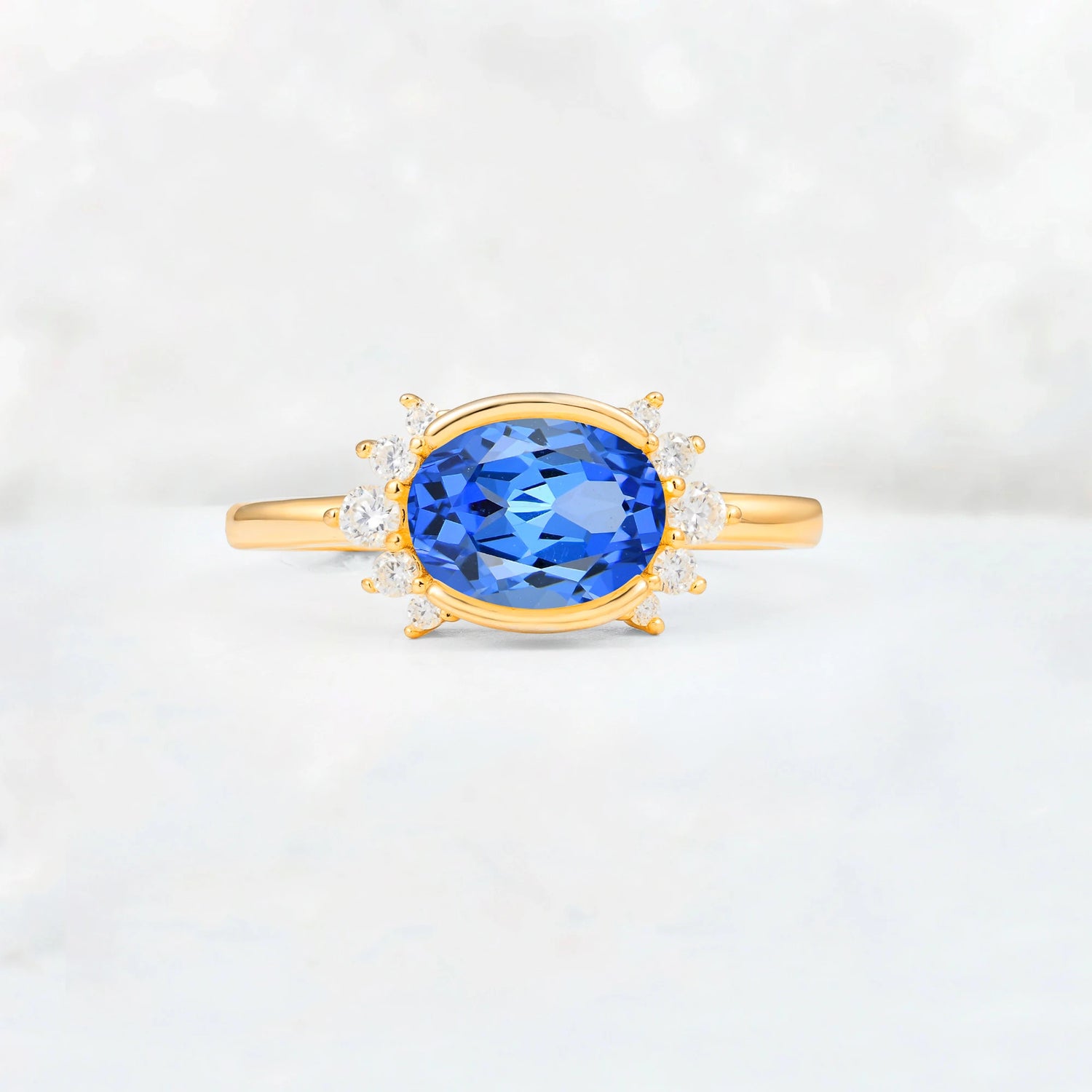 Timeless Oval Cut Bezel Frame Halo Sapphire Engagement Ring