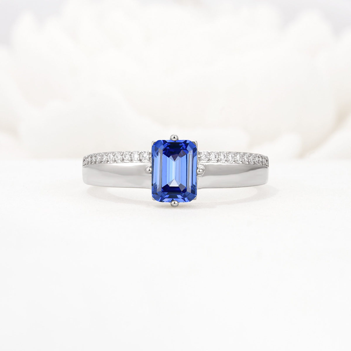 Emerald Cut Sapphire Tapered Pavé Solitaire Engagement Ring - Additional view