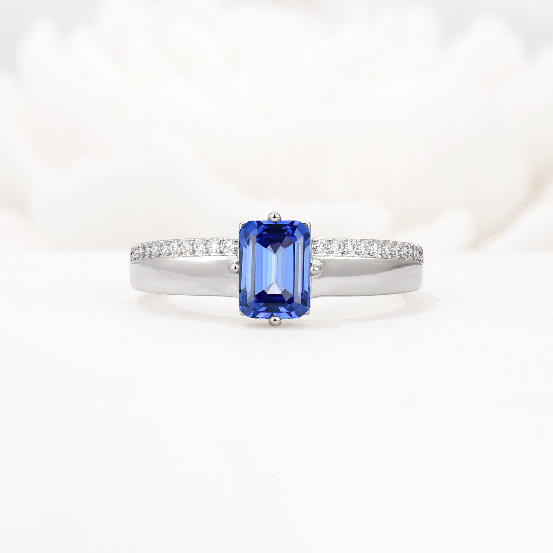 Emerald Cut Sapphire Tapered Pavé Solitaire Engagement Ring - Additional view