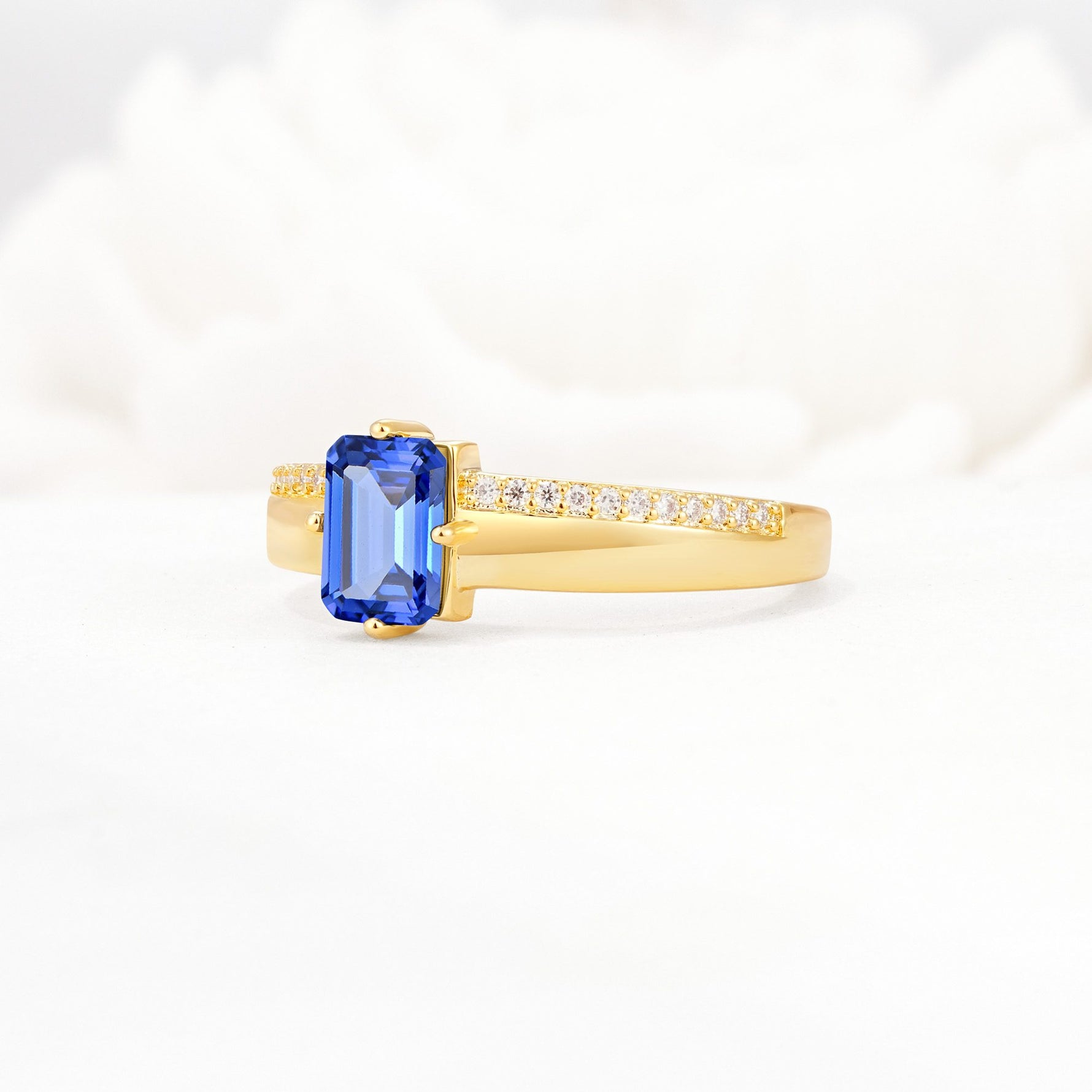 Emerald Cut Sapphire Tapered Pavé Solitaire Engagement Ring - Additional view