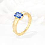 Emerald Cut Sapphire Tapered Pavé Solitaire Engagement Ring - Additional view