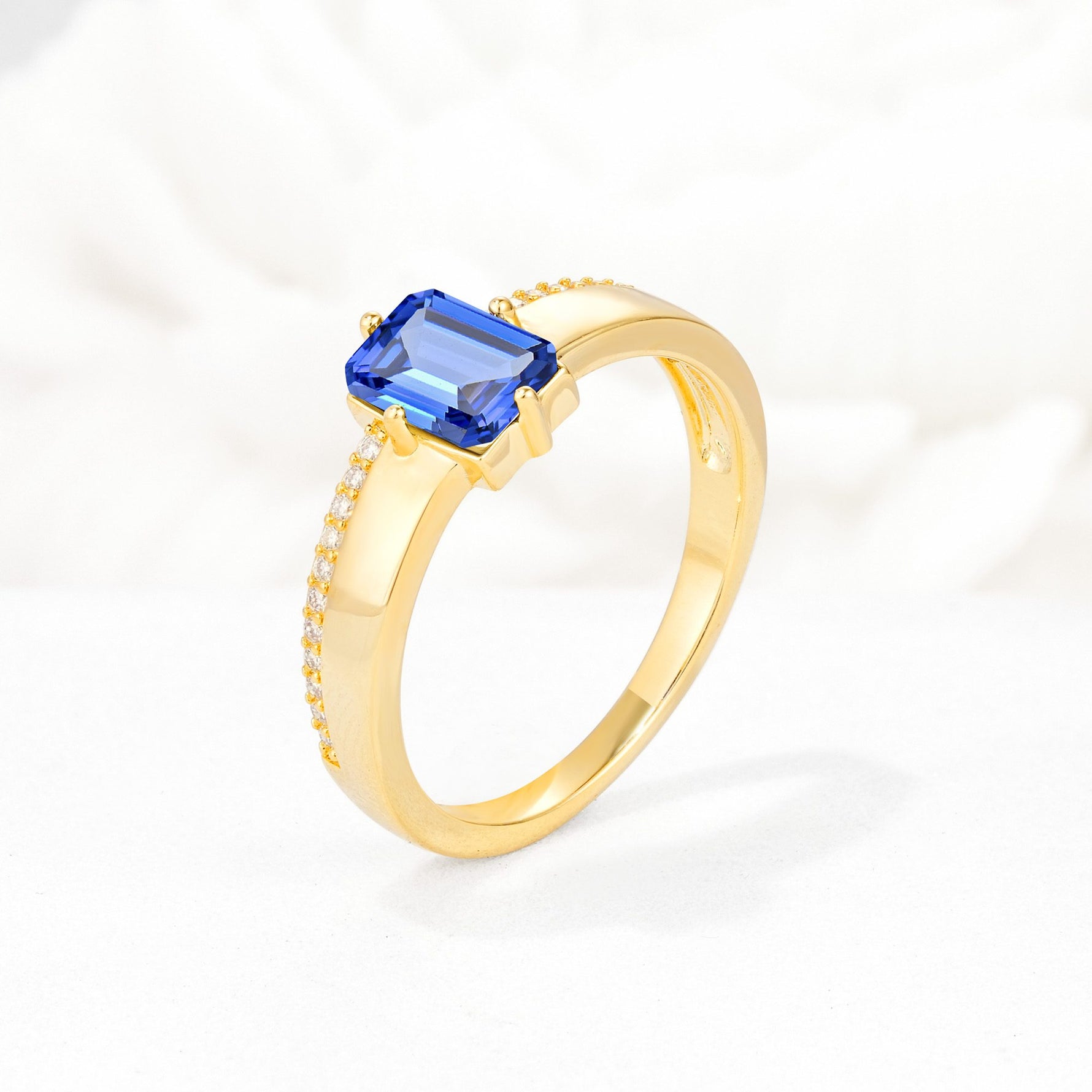 Emerald Cut Sapphire Tapered Pavé Solitaire Engagement Ring - Additional view